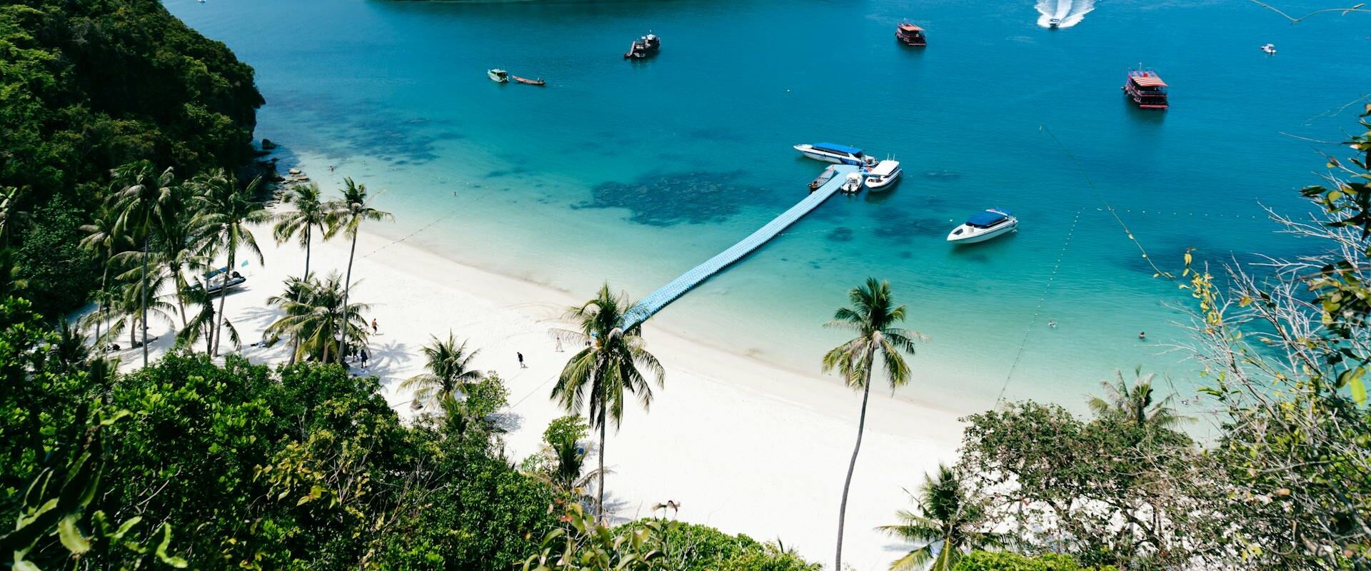 Ang Thong Marine Park’s turquoise lagoons on an Ang Thong Travel guide banner by Legend Travel Group.